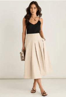 Elegant stone pleated midi skirt in a high waisted silhouette for women's smart casual fashion.