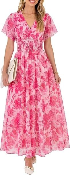 Best Summer Dresses 2026 You Need in Your Wardrobe 2 A smiling model wearing the ANRABESS Women Summer Floral Maxi Dress in white and hot pink floral, featuring short flutter sleeves and a flowy tulle overlay for warm-weather fashion.