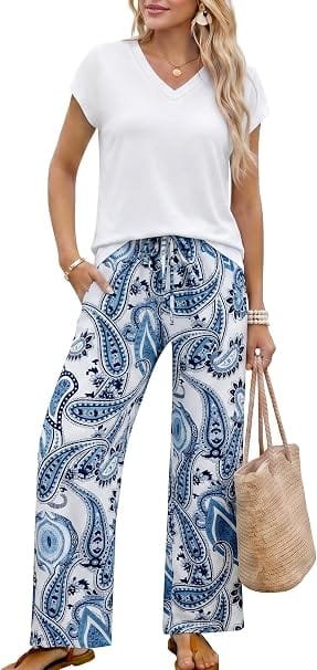 Best Stylish Dresses Under $40 to Refresh Your Wardrobe This Year 9 Front view of a model wearing a Casly Lamiit blue floral two-piece summer outfit featuring a V-neck cap sleeve top and wide-leg pants with pockets, showcasing trendy travel and vacation clothes under $40.
