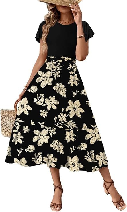 Best Summer Dresses 2026 You Need in Your Wardrobe 12 A model wearing the Dokotoo Women's Summer Maxi Dress Ruffle Short Sleeve Casual Floral Print Long Flowy Dresses in black and white floral, featuring short ruffle sleeves and a flowy A-line skirt for warm-weather fashion.