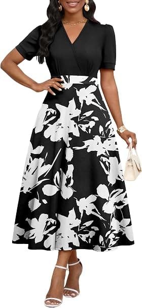 Best Summer Dresses 2026 You Need in Your Wardrobe 9 A model wearing the MarryUP Women's Midi Dresses - V Neck Cocktail & Church Tea Dresses - Short Sleeve A-Line Swing Dress in black and white floral, featuring short sleeves and an A-line swing skirt for warm-weather fashion.