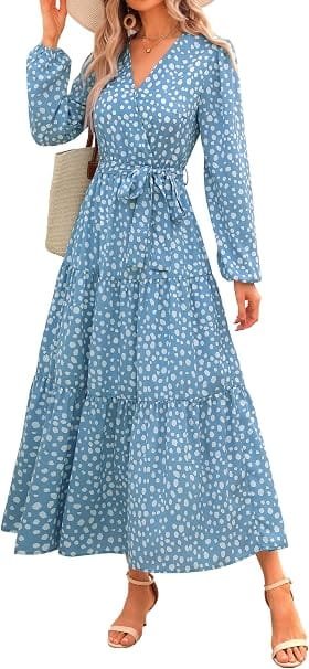 Best Summer Dresses 2026 You Need in Your Wardrobe 14 A model wearing the PRETTYGARDEN Womens Long Sleeve Boho Floral Wrap Maxi Dress in dot blue white, featuring long puff sleeves, a tie waist, and a tiered A-line skirt for warm-weather fashion.