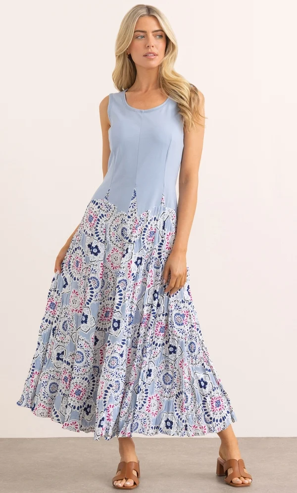 15 Stunning Trendy Summer Dresses Ideas To Elevate Your Style In 2026 14 A model wearing the Printed Parachute Dress in blue and pink featuring a sleeveless bodice and a panelled skirt, styled for casual summer wear.