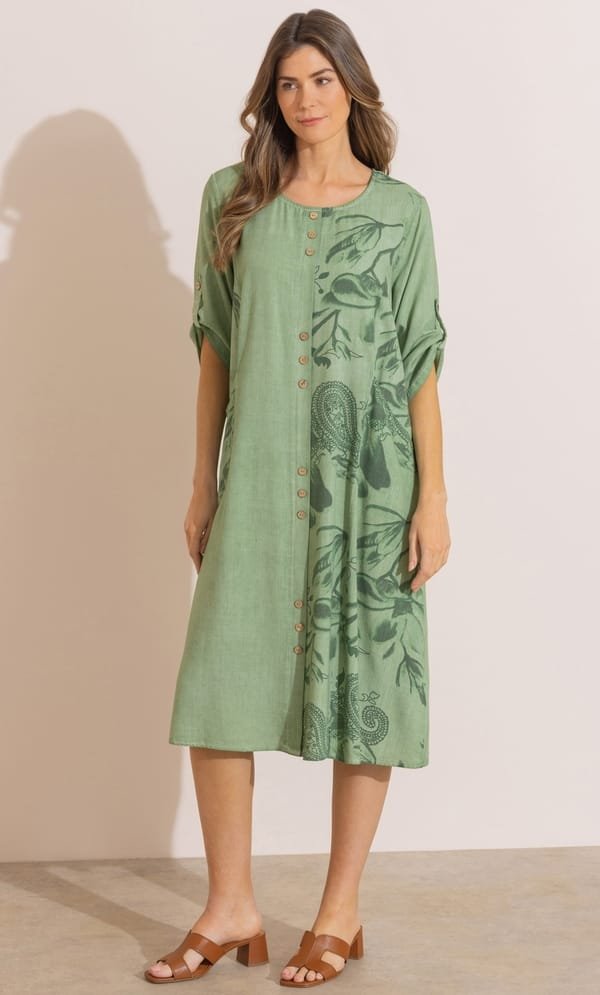 15 Stunning Trendy Summer Dresses Ideas To Elevate Your Style In 2026 15 A model wearing the khaki Printed Relaxed Fit Linen Blend Dress featuring a round neckline, three-quarter sleeves, and front pockets for casual summer styling.