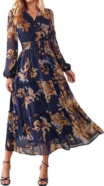 Best Summer Dresses 2026 You Need in Your Wardrobe 15 A model wearing the Simplee Womens Floral Boho Maxi Dress Long Sleeve Flowy Wedding Guest Dress in navy blue and gold floral, featuring long sleeves, an empire waist, and a ruffle tiered skirt for warm-weather fashion.