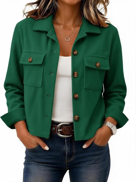 A stylish woman wearing a dark green Zeagoo Women's Fashion Cropped Corduroy Jacket button-down shirt jacket paired with a belt and jeans, posing outdoor against a neutral backdrop.