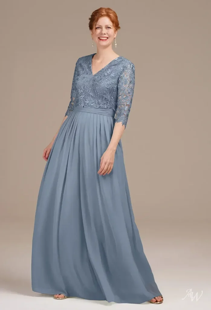 Full-length front view of a model wearing the AW Barnett Dress in sage green chiffon, featuring a V-neckline, 3/4 lace sleeves, and a flowing floor-length A-line cut ideal for weddings.