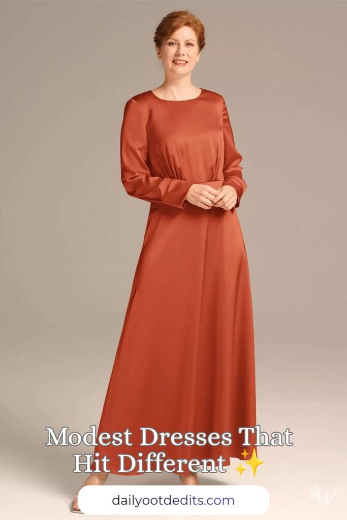 A floor-length modest formal dress in vibrant tangerine satin charmeuse, perfect for formal summer events and weddings.