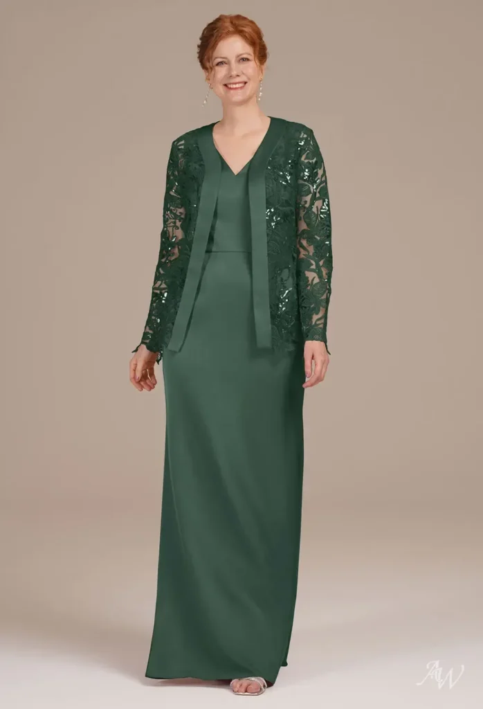 Full-length front shot of a model wearing the AW Loraine Dress in hunter green, featuring a mermaid silhouette, V-neckline, and detailed lace jacket overlay tailored for wedding guests and mothers.