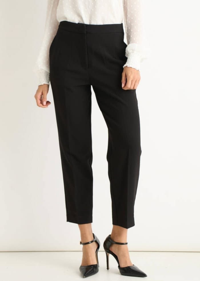 The Perfect Office Capsule Wardrobe: 2026 Work Essentials Guide 6 Pair of black ankle grazer cigarette tailored trousers for professional summer style.