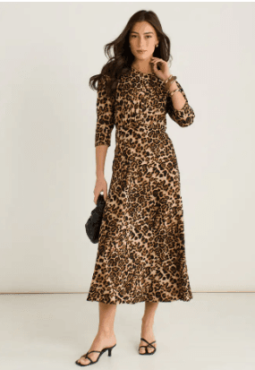 Best Midi Dresses Under £60 for Summer 2026 2 A model wearing a stylish brown animal print satin shift midi dress with an A-line silhouette from Gini London.