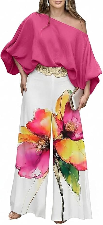 Full-length fashion shot of a woman wearing the CHICME Off-Shoulder Lantern Sleeve Two-Piece Resort & Travel Set featuring a vibrant multi-color artistic print on the bottoms and a striking bold top, ideal for stylish travel and summer resort wear.