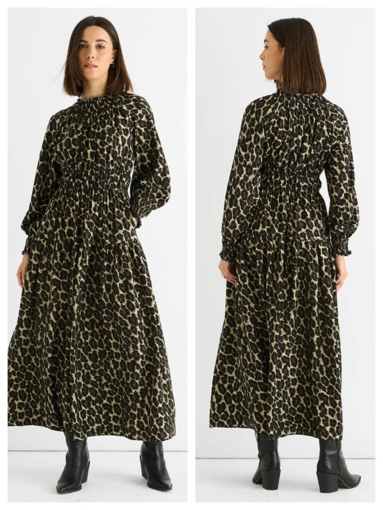 A model wearing a stylish khaki animal print high-neck shirred maxi dress for a modest 2026 summer look.