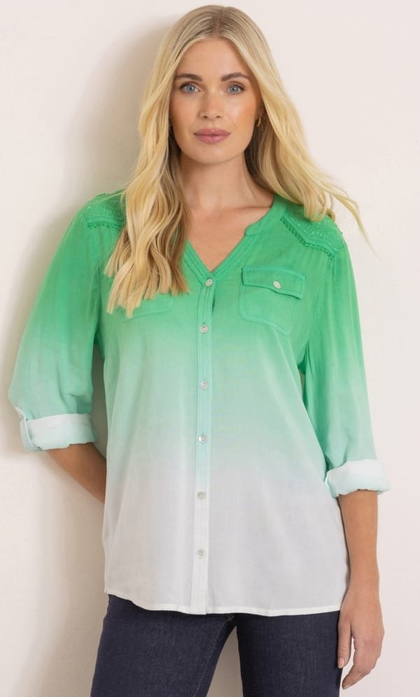The Perfect Office Capsule Wardrobe: 2026 Work Essentials Guide 17 Studio shot of a model wearing the Klass green and white embroidered dip-dye shirt with a grandad collar and long sleeves, styled for a modern 2026 office capsule wardrobe.