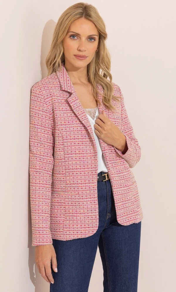 The Perfect Office Capsule Wardrobe: 2026 Work Essentials Guide 18 Studio portrait of a model wearing the Klass pink multi boucle fitted blazer featuring an open front, collar, and subtle shimmer woven fabric, styled for a 2026 office capsule collection.