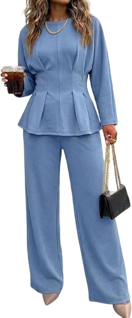 Business Casual Outfits for Women: 15 Best Work-Ready Looks for 2026 2 Professional blue two-piece business casual outfit for women featuring a long-sleeve waist-ruched top with subtle ruffles and matching high-waisted wide-leg trousers, styled with a black handbag for office and commute wear. Business casual outfits for women — blazer and trouser co-ord set for 2026