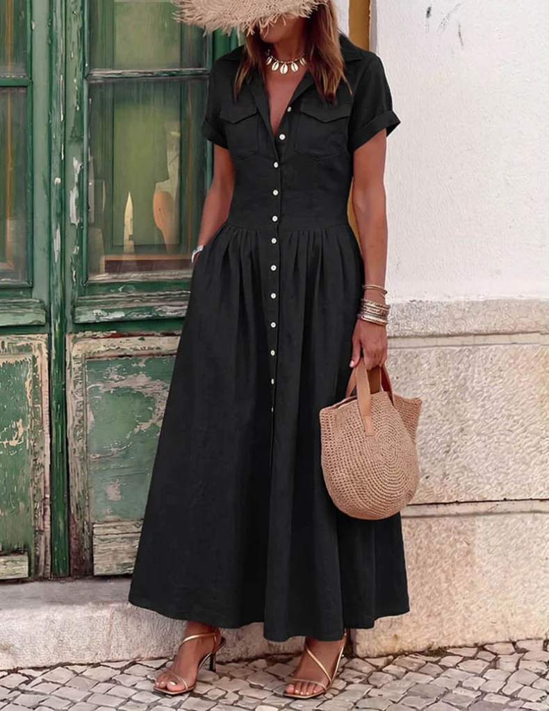 Business Casual Outfits for Women: 15 Best Work-Ready Looks for 2026 16 Black button-down maxi shirt dress with flared hem, styled as a business casual outfit for women for office and evening wear.