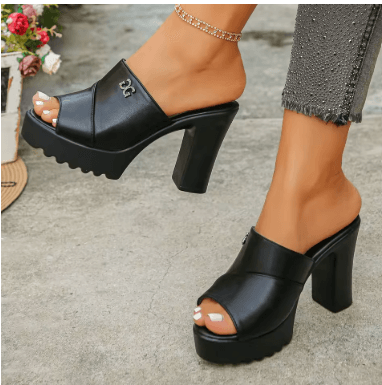 25 Minimalist Capsule Wardrobe Essentials 2026 | Timeless Pieces Every Woman Needs 21 A pair of stylish, black high-heeled platform slippers with a fish-mouth open toe, perfect for a chic 2026 capsule wardrobe outfit.