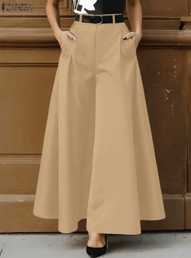25 Minimalist Capsule Wardrobe Essentials 2026 | Timeless Pieces Every Woman Needs 2 A model wearing high-waisted wide-leg trousers from the 2026 ZANZEA collection, styled for a minimalist office-ready look; these comfortable trousers are featured in various colors including khaki, black, blue, and green.