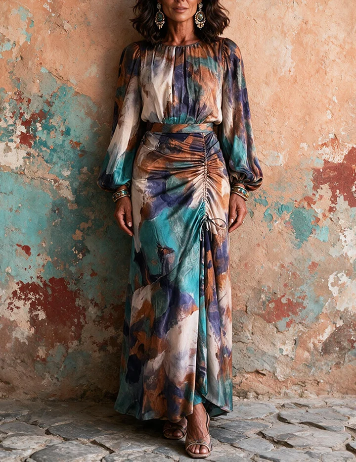 Trendy & Affordable Outfits for Women You'll Actually Love (2026) 5 A stylish woman wearing an affordable teal, blue, and rust abstract print long-sleeve ruched maxi dress, styled for a modern evening look featuring Trendy Outfits for Women.
