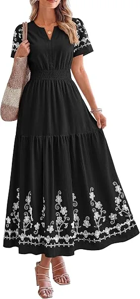 A fashion creator styling the PRETTYGARDEN Women's Summer V Neck Floral Boho Maxi Dress in classic black featuring intricate white embroidery, paired with heels for an upscale event aesthetic.